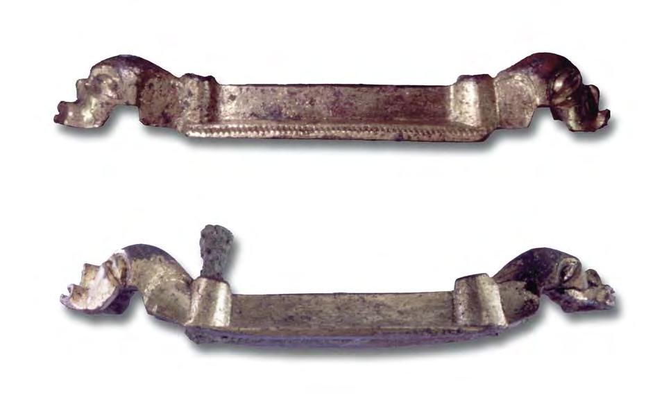 Fig. 9. Two mountings which perhaps were applicated on a sword scabbard (length 67 mm). Germanic Iron Age. B on fig. 1. other areas. The implements must have been destroyed before they were deposited.