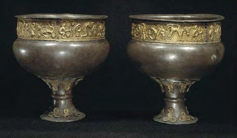 Fig. 9. Metal beakers with embossed foil bands from Himlingøje, Zealand. Photo: National Museum, Copenhagen. Height 11.0 and 11.5 cm.