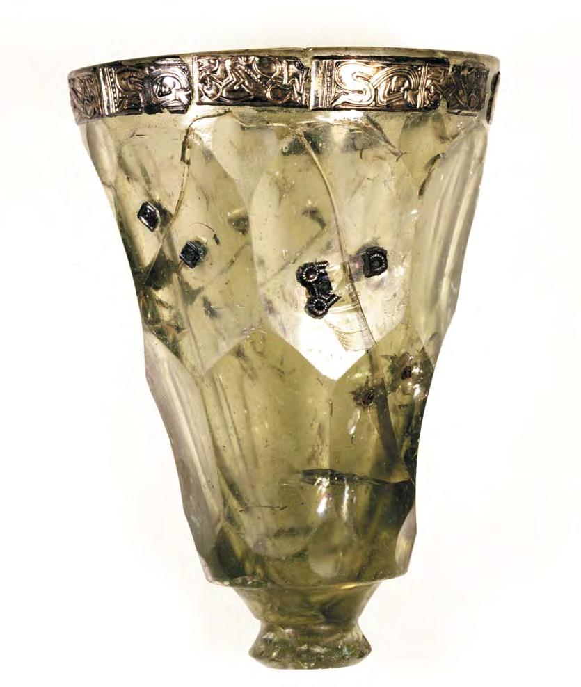 Fig. 11. The glass with embossed foil from Snartemo, Vest-Agder, Norway. Photo: E. I. Johansen, UKM. Height 15.3 cm. holes had been drilled in the glass.