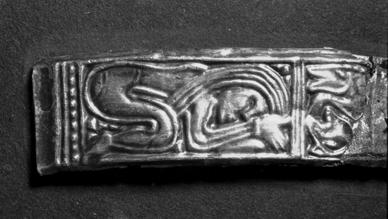 Fig. 18. The embossed foil band from Snartemo, Vest-Agder, Norway. Photo: UKM, Oslo. Width 1.3 cm. shows two regularly alternating figure panels.