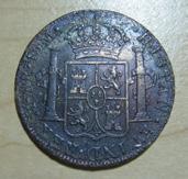 of Glen Mills, PA, found this 8-reale Spanish coin dated 1777 (see images above) on a stretch of New Jersey beach that had been deeply excavated.