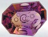 The miners extract about 30 40 tonnes of amethyst, citrine, and ametrine (bicolored amethyst-citrine; see figure 12 inset) every month, which is processed at the company s facility in the city of
