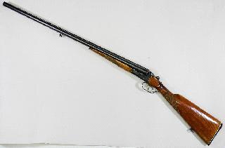 $15 - $25 Lot # 487 487 Baikel Russian 12 gauge double barrel shotgun, model IJ58M.