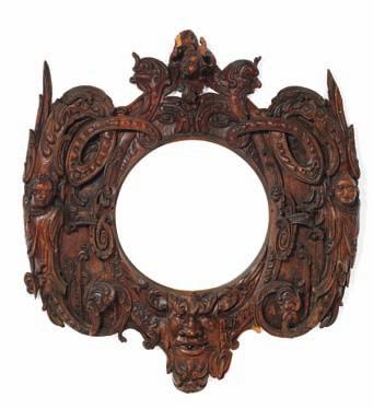 171 171 A Baroque oak carving/picture frame carved with leaf ornaments, grotesques and Satyr masks. Outer measurements C. H. 130 cm. W. 140 cm. Inner measurements H. 58 cm. W. 56 cm.