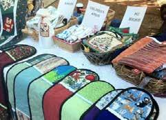Handmade items, some made with Christmas fabrics, such as patchwork quilts, ironing board