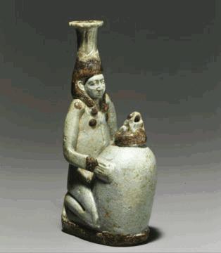 Unknown Double-Spouted Vessel in the Form of a Kneeling Figure with a Jar, 625-575 BC Object: H: 11.4 W: 4 D: 6.