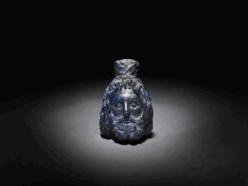 3 143. Unknown Head of Serapis, AD 1-200 Lapis lazuli Object: H:.8 cm (3 7/8 in.
