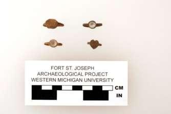 Figure 5. A Selection of Jesuit/Iconographic and Glass Inset Rings Photo by John Lacko, courtesy of the Fort St. Joseph Archaeological Project.