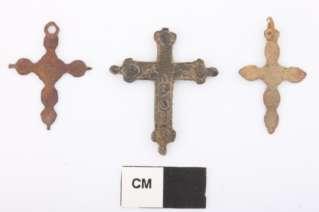 Figure 10. Two Crosses Flanking a Crucifix (Center) Photo by John Lacko, courtesy of the Fort St. Joseph Archaeological Project. Brass religious medallions have also been recovered at Fort St.