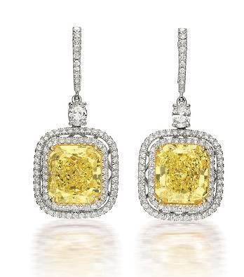 This current pair of Important 8.06 and 8.00 Carats Natural Fancy Intense Yellow Diamond and Diamond Pendent Earrings (Est.