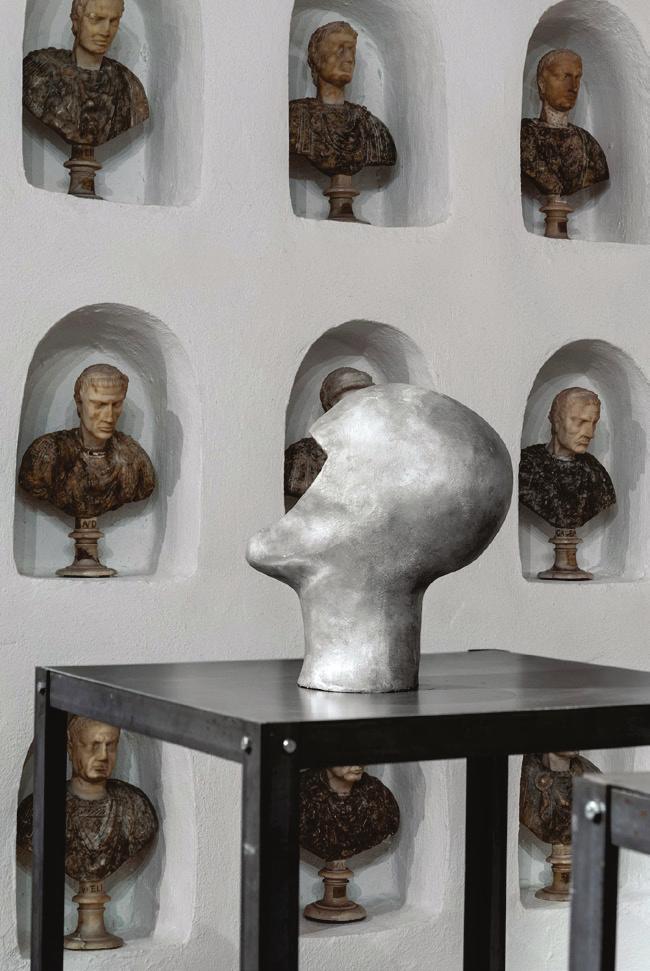 installation: 11 heads of wax, 19