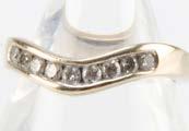A modern 18ct white gold and diamond wishbone shaped half hoop eternity ring, 2.