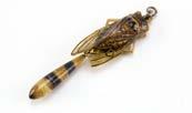 An Art Deco period carved horn insect pendant, modelled as a cicada or wasp, damaged wing, with drop 559.
