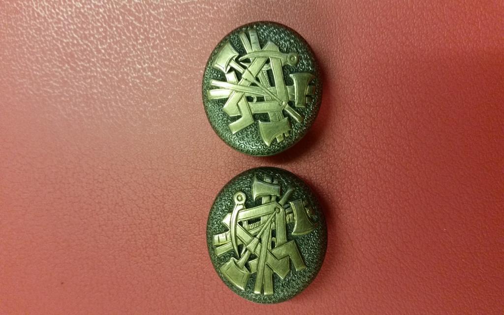 Before restoration During restoration Good as new Mysterious Buttons Can anyone help us with a mystery, we have in the Museum a pair of metal