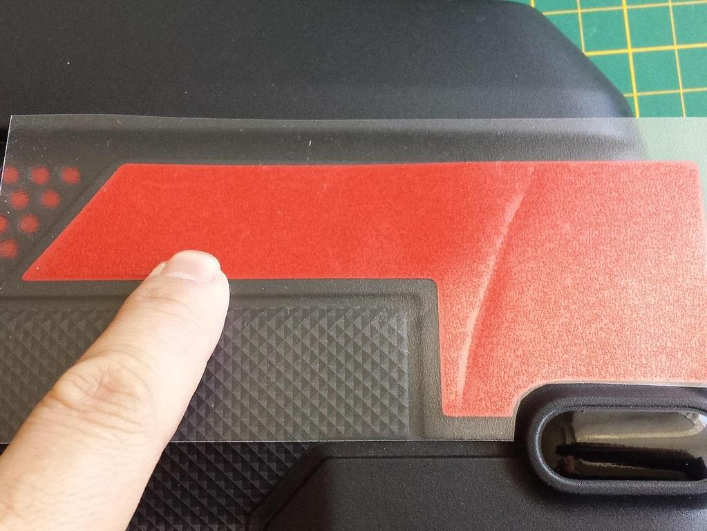 Remove badgeskin from backing, align and