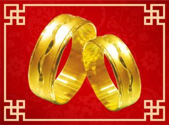 Exquisite design with a polished texture, this pair of precious and finely crafted gold rings represent everlasting love and