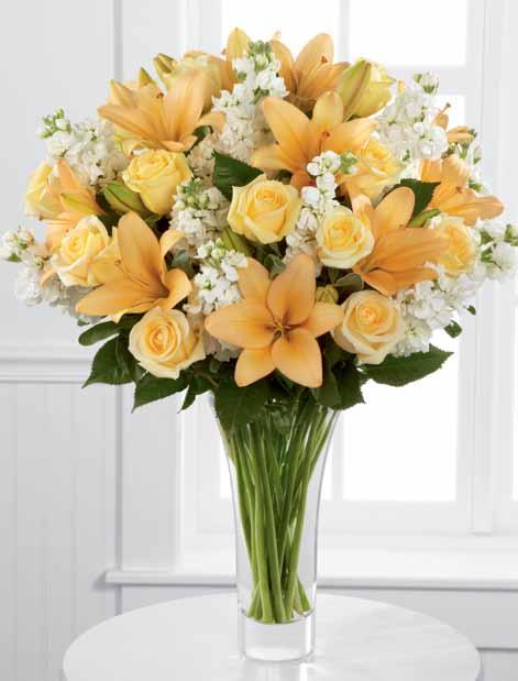 Flowers say it better. ftd says it best. distinctive details The soft hues of pale yellow roses, peach Asiatic lilies and fragrant white stock capture the glow of happiness.