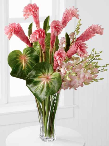 the ftd luxury collection unique pairings This unexpected combination of pink orchids, pink ginger and green anthurium is set in our beautifully twisted vase, handcrafted to hold abundant bouquets.