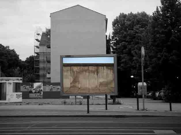 Gianluca Malgeri 2009 Cheap, 2009, public action, photo printed on PVC, glue, 300 x 200 cm For several years I thought of doing a work on the Berlin Wall, and for the 20th anniversary of its fall I