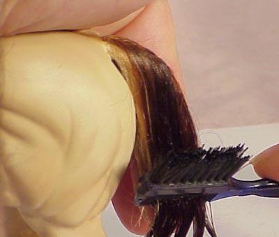 as you go. Arrange hairs so they evenly flow down and to either side of the tail bone.