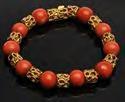 Estimate: $ 200.00 - $ 300.00 Lot #469: GOLD AND CORAL BRACELET Stamped 18k; approx. 7 1/2 in. Estimate: $ 150.00 - $ 250.