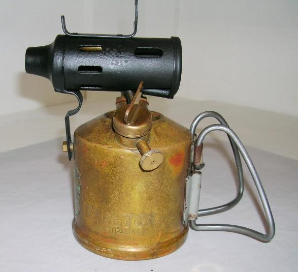 At least two different types of soldering iron holder were fitted to Darlton lamps.