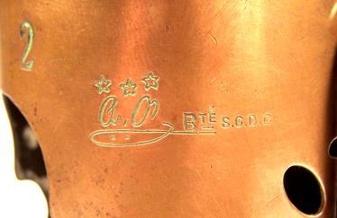 The trademark shown in Figure 17 also lacks the engraved DÉPOSÉ mark. This imprint, however, also has the lettering BTÉ S.G.