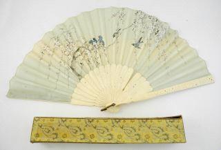 Lot # 629 629 630 631 632 633 634 635 636 637 Asian good quality painted silk fan with carved boards. Woven tray. Salish woven rectangular shaped basket, 12 1/2".