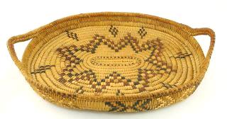 with beaded wolf decoration. $80 - $120 453 454 Salish woven circular two handled tray, 8 3/4".