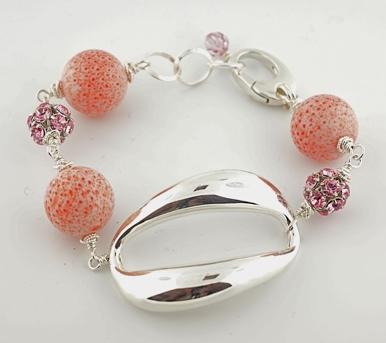 28mm by 40mm sterling silver oval, 12mm coral beads and 8mm pink Swarovski