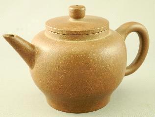 Chinese brown stoneware Yixing ware teapot decorated with small teapot inside,l.5 1/2". Lot # 552 552 branch decoration, length 7 1/4".