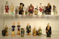 The biggest: 7,5 x 16 cm - 3 x 6,5" 1184 IVORY PLASTIC BONE Seven ivory figurines of characters. Also included: An ivory cup.