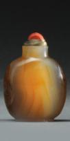 5 1211 SNUFF BOTTLES Lot comprising three red Pekin glass and stone snuff bottles. Stoppers. H (the tallest): 7.
