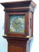 308 An early 19th Century period mahogany and brass inlaid eight day Mantel Clock, the architectural style pediment with inverted brass finial s above a white enamel dial with Roman numerals and