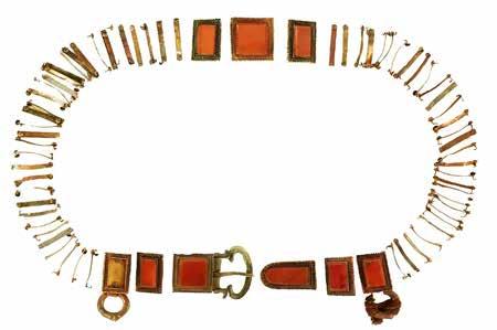 These pieces originally might have been inlaid with gems, but are all missing now. Gold pectoral necklaces were found in Tombs M3 and M6. The one from M3 [Fig. 22] is U-shaped, ca. 28.