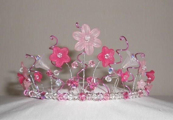 Flower Power Pretty Lucite flower tiara. Made with various sizes and colours of Lucite flowers, pink 'wiggly' wires, crystals, and gorgeous pink Swarovski crystals on a silver plated tiara band.