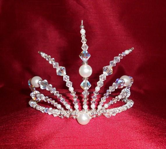 White Russian Stunning Russian style tiara. Very unusual design. Made with white glass pearls, clear glass beads, Swarovski crystals, Tibetan silver beads and glass facets on a silver plated band.