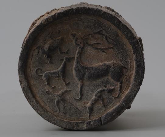 123. Inventory number: AH81:44 Object title: Roof-tile end with deer, toad, dog and wild goose design Dimensions: Diameter 13cm; Length 11.5cm Material: Pottery Date made: Warring States Period (c.