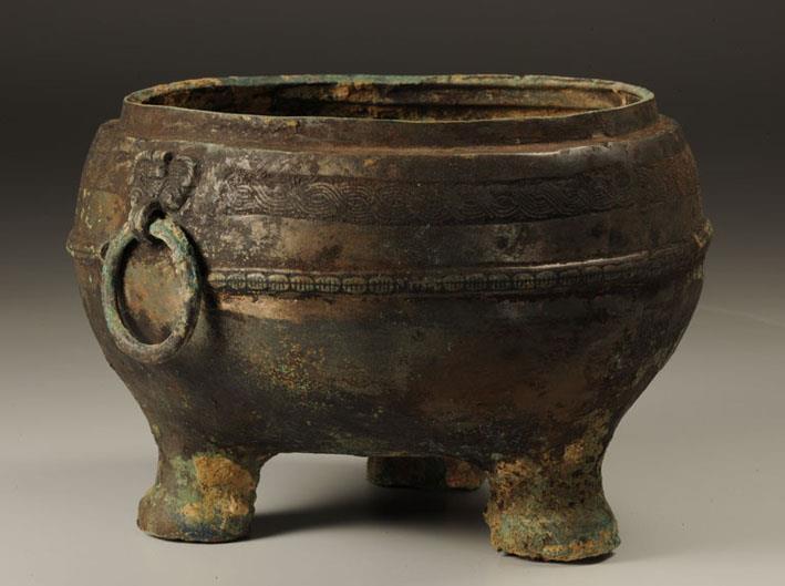 55. Inventory number: 2011 Object title: Tripod Ding (vessel), decorated with rope and shell-shaped patterns. Dimensions: Height 12.