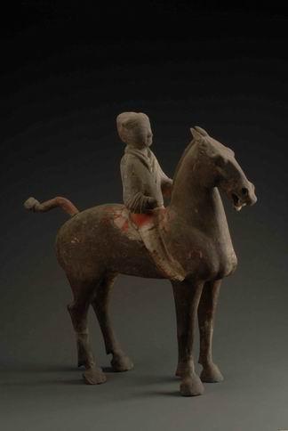 94. Inventory number: Yqd011 Object title: Painted cavalryman figure on a horse Dimensions: Height 68cm; Length 63cm Material: Pottery Date made: Han Period (206 BCE 220 CE) Xianyang Museum No.