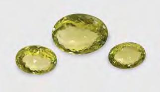 Figure 12. At 49.29, 25.05, and 21.12 ct, these greenish yellow to yellow-green sillimanites from India are impressive for their size and color. Courtesy of Anil B. Dholakia Inc.