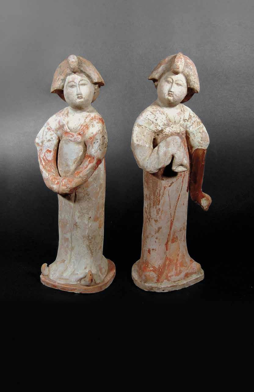 7. Pair of Chinese Pottery Figures TANG DYNASTY, AD 618-907 Of unusual type; each dressed in a long