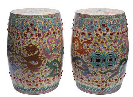 539 A pair of Chinese yellow-ground porcelain garden seats each of barrel shaped form, the sides and top pierced with cash motifs between bands of