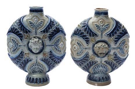 * 250-350 590 A pair of Martin Brothers salt glazed stoneware inkwells of tapering square profile, the facets incised with simple blooms and insects, inscribed Martin London on one facet, 6 cm high,