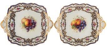 618 A Royal Worcester fruit painted porcelain part service with scalloped rims, painted by Harry Martin with bunches of fruit and flowers on a gilded powder blue