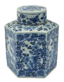 518 A Chinese blue and white sauceboat and a tea caddy and cover the sauceboat of silver shape, painted with