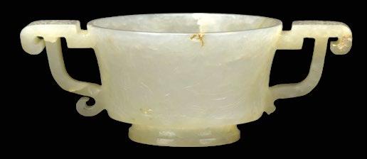 82 A Chinese Jade Cup, 17th Century A Chinese Jade Cup, 17th Century, white jade with archaic handles carved with taotie motif, on the
