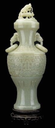 $5,000 - $7,000 94a A Chinese Jade Covered Vase, Republic Period A Chinese Jade Covered Vase, Republic Period, of flattened baluster form, carved with stylized taotie in central band around body,