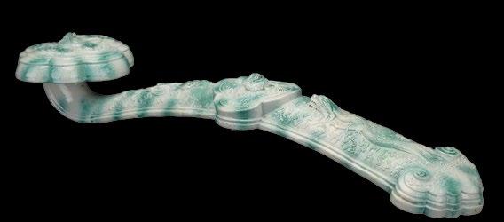 114 A Chinese Porcelain Faux Jadeite Ruyi Scepter A Chinese Porcelain Faux Jadeite Ruyi Scepter, Guangxu period, the heavily cast porcelain