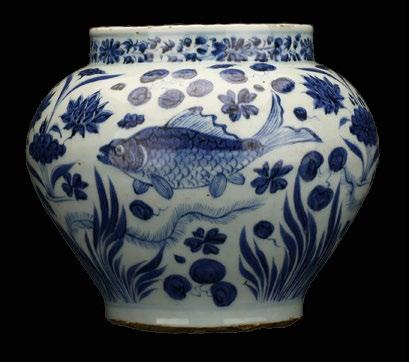 183 A Chinese Blue and White 'Fish' Jar, likely Yuan A Chinese Blue and White 'Fish' Jar, likely Yuan period, finely painted with three fish swimming among lotus blossoms above eel grass, the short